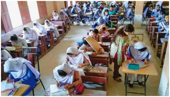 Students taking an exam at an examination centre. — PPI