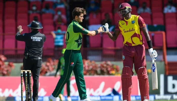 Shaheen Shah Afridi (left) bumps fists with a West Indian player. — ICC/File