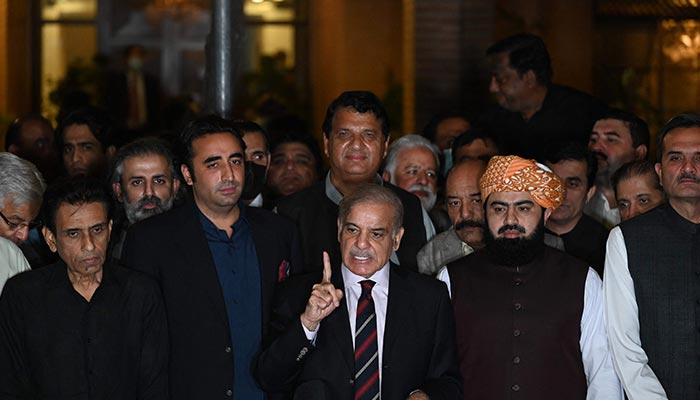 Prime Minister Shehbaz Sharif (C) speaks flanked by Bilawal Bhutto Zardari (3rdL) during a press conference with other party leaders in Islamabad on April 7, 2022. — AFP