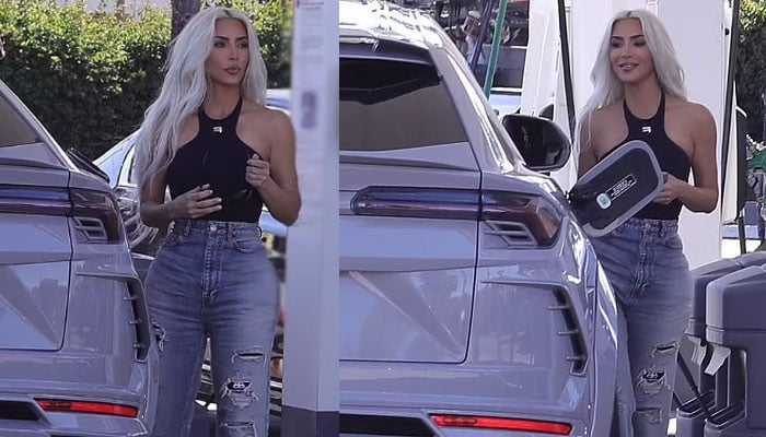 Kim Kardashian slays in black halter top and ripped jeans