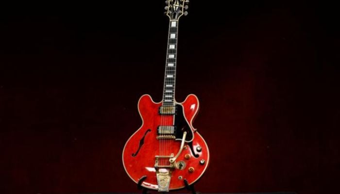 Gibson guitar smashed on night rock band Oasis split sold at auction