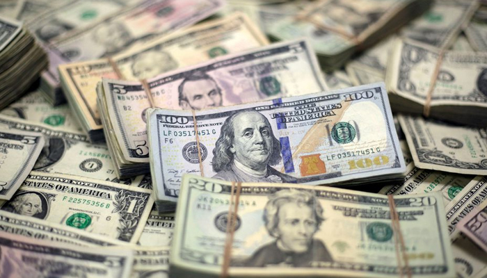 Several bundles of dollar bills. — Reuters/File