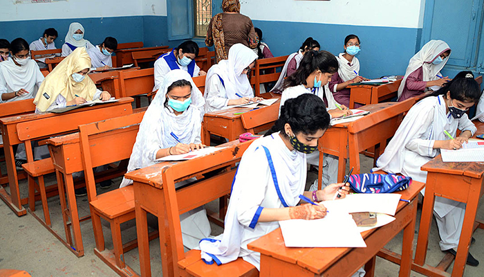 Students solving question papers during the annual examination of HSC (Part-II) at Hayat Girl’s High School in Hyderabad, on July 27, 2022. — APP