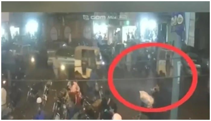 Image from the CCTV footage of Saddar blast highlighting the suspect standing by the bicycle. — YouTube/ Geo News Live