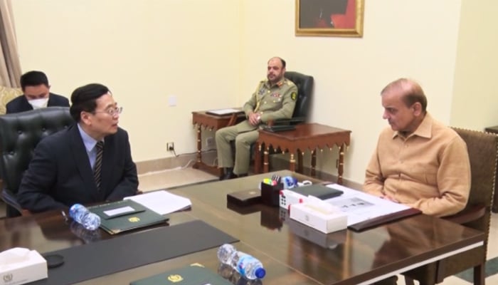 Prime Minister Shehbaz Sharif (right) speaks to China’s External Security Commissioner Cheng Guoping at the Prime Ministers Office in Islamabad, on May 19, 2022. — PM Office