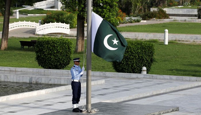 A member of the Pakistan Air Force (PAF) rehearses flag masting at the mausoleum of Muhammad Ali Jinnah before Defence Day ceremonies, or Pakistans Memorial Day, in Karachi, Pakistan September 6, 2020. — Reuters