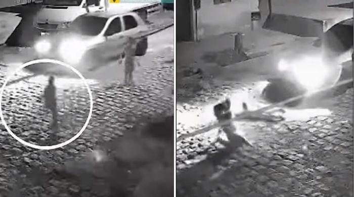 Watch: Mother jumps in front of speeding car to rescue son