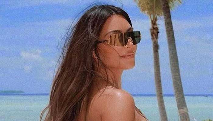 Kim Kardashian steals Kourtneys wedding thunder by sharing her eye-popping beach snap