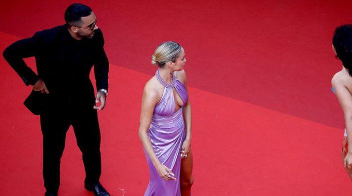 Protester Painted in Ukraine Colors Ejected From Cannes Red Carpet