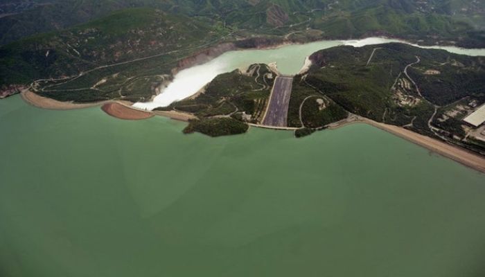 The picture shows water leaving the Tarbela Dam spillway in Tarbela on Aug. 24, 2010. — AFP