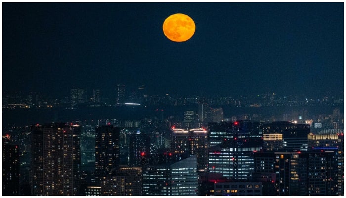Super Blood Moon seen above a city. — AFP/File