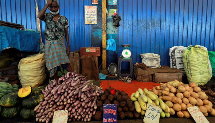 A vegetable seller selling vegetables in a local market. — Reuters/File