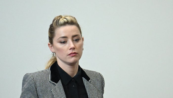 Amber Heard looks disappointed as her claims rejected in Johnny Depp trial