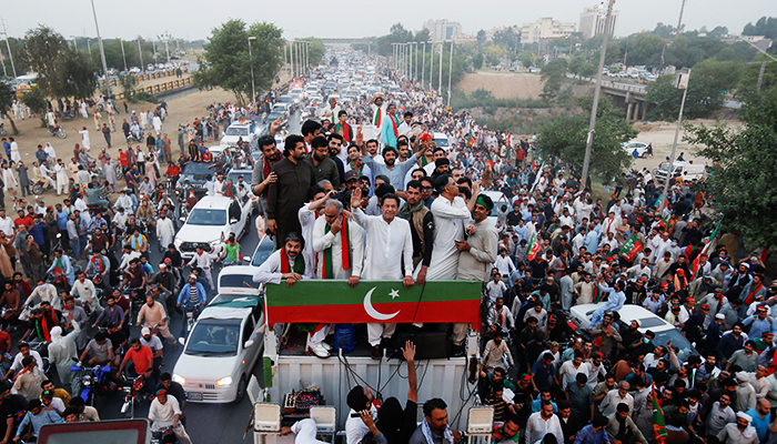Ousted prime minister Imran Khan gestures to the crowd as he travels on a vehicle to lead a protest march in Islamabad, Pakistan May 26, 2022. — Reuters
