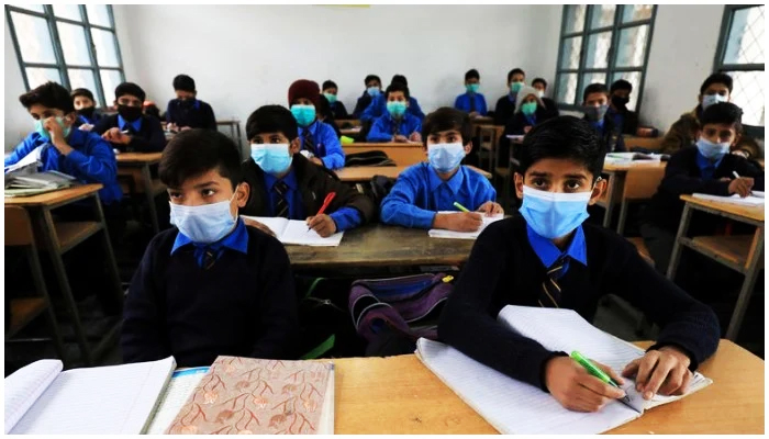 Students wear protective masks as they attend a class at school in Peshawar, Pakistan November 23, 2020. — Reuters