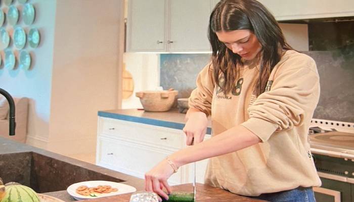 Kendall Jenner chopping a cucumber yet again! Photo