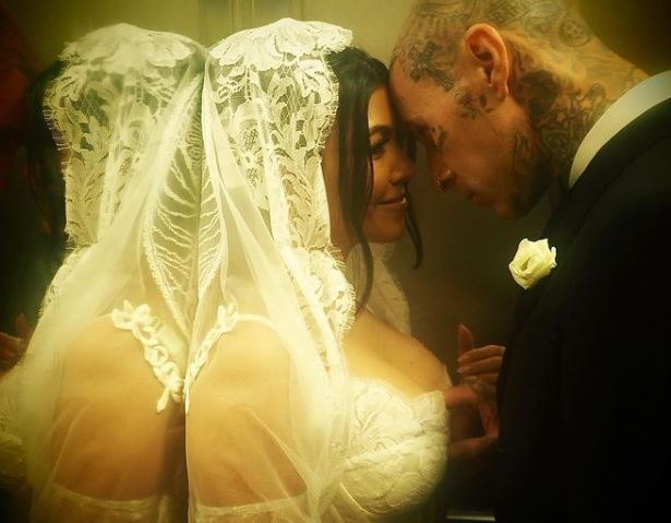 Kourtney Kardashian, Travis Barker share NEW cheeky photos from wedding