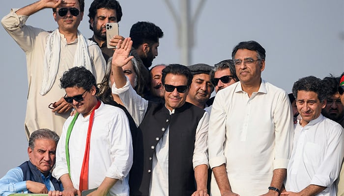 Ousted prime minister Imran Khan (C) waves at his party supporters during a rally in Islamabad on May 26, 2022. — AFP/FIle