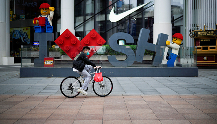 A man rides a bicycle at a main shopping area during lockdown, amid the coronavirus disease (COVID-19) pandemic, in Shanghai, China, May 26, 2022. — Reuters