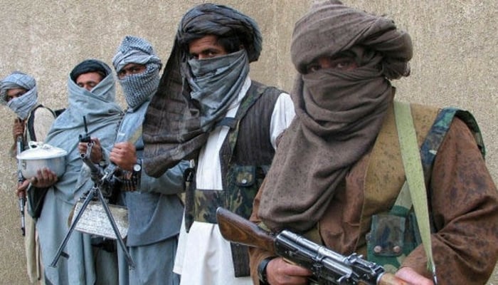 Armed Taliban fighters stand in a line. — Reuters
