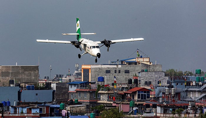 Tara Airs DHC-6 Twin Otter, tail number 9N-AET prepares to land at the airport of Pokhara, Nepal, on April 11, 2022. — Reuters