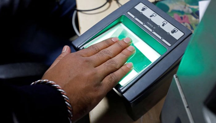 A woman goes through the process of finger scanning for the Unique Identification (UID) database system, also known as Aadhaar, at a registration centre in New Delhi, India, on January 17, 2018. — Reuters