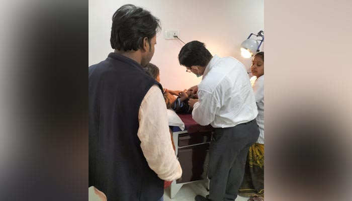 The picture shows girl getting treatment from doctor. — Twitter/SonuSood