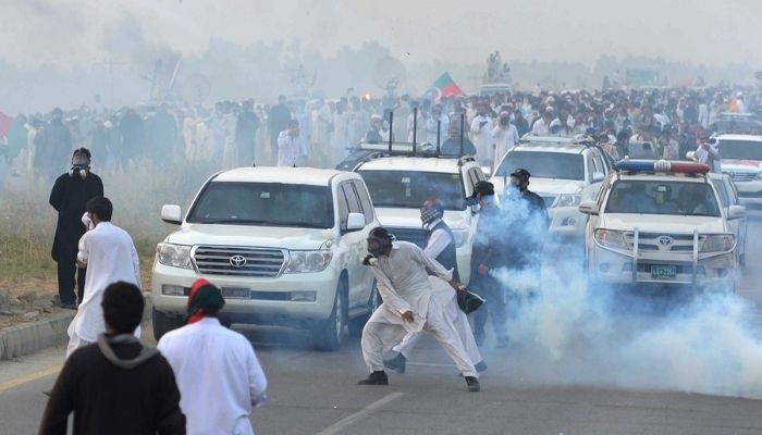 Clashes between police and PTI supporters in Islamabads red zone. — AFP