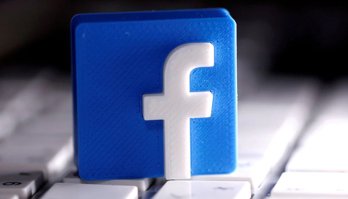 A 3D-printed Facebook logo is seen placed on a keyboard in this illustration taken March 25, 2020. — Reuters