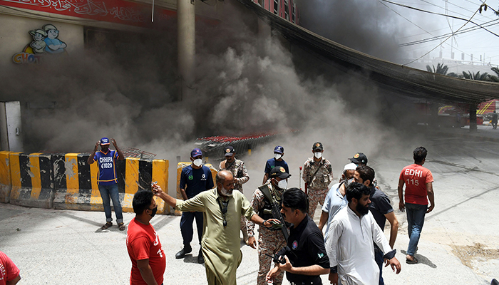 A view of the smoke rising after a fire broke out at a superstore store in Karachi, on June 1, 2022. — Online