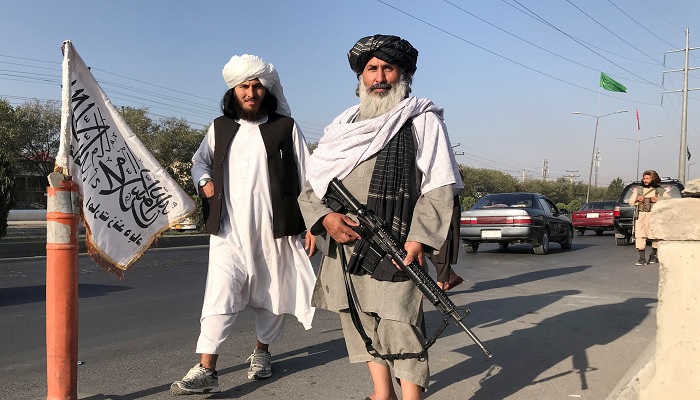 A Taliban fighter holding an M16 assault rifle stands outside the Interior Ministry in Kabul, Afghanistan, August 16, 2021. — Reuters