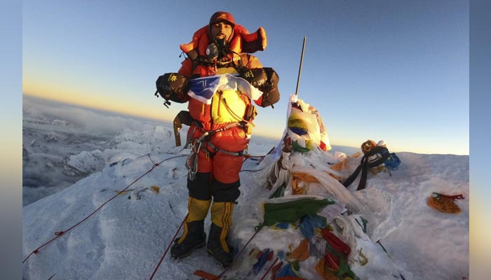 Indian mountaineer Narender Singh Yadav posing at the summit of Mount Everest. — AFP