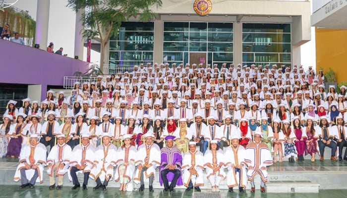 Students and faculty members of the Habib University pose during the varsitys fifth convocation in Karachi, on June 4, 2022. —Habib University