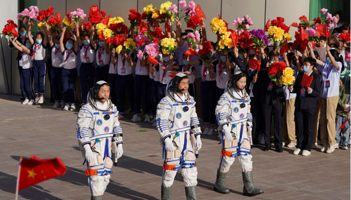 Chinese astronauts attend a see-off ceremony before the launch of the Long March-2F carrier rocket, carrying the Shenzhou-14 spacecraft for a crewed mission to build Chinas space station. — Reuters