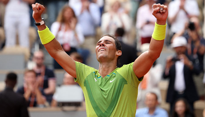 Spains Rafael Nadal celebrates after victory over Norways Casper Ruud in their mens singles final match on day fifteen of the Roland-Garros Open tennis tournament at the Court Philippe-Chatrier in Paris on June 5, 2022. — AFP