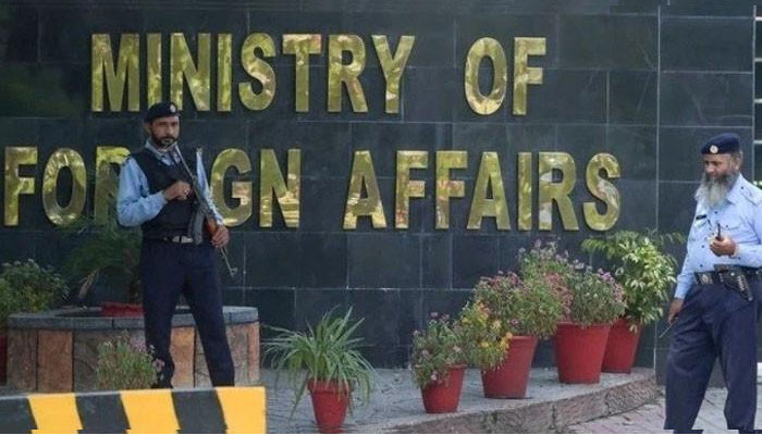 Two guards stand outside of the Ministry of Foreign Affairs office in Islamabad, Pakistan. — AFP