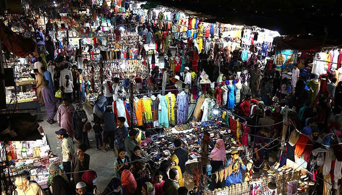 A view of the rush in the Hyderi Market in Karachi during Eid shopping. — INP