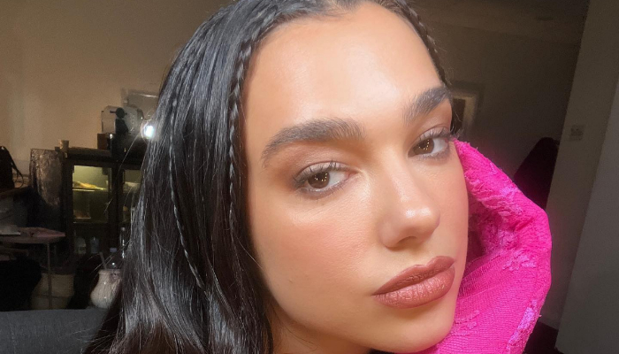 Showing off her travel style, Dua Lipa was seen in a tropical mini-dress in Portugal