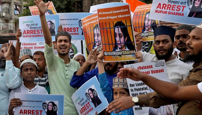People shout slogans as they hold placards during a protest demanding the arrest of Bharatiya Janata Party (BJP) member Nupur Sharma for her blasphemous comments on Prophet Mohammed, in Kolkata, India, June 7, 2022. — Reuters/File