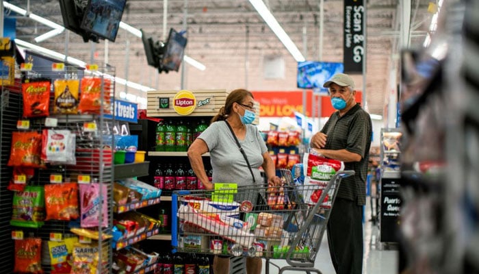 Shoppers are seen wearing masks while shopping at a Walmart store, in North Brunswick, New Jersey, U.S. July 20, 2020. Photo—REUTERS/Eduardo Munoz