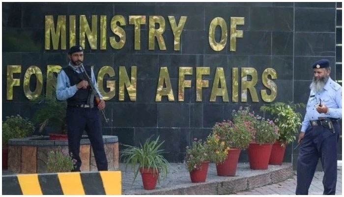 Two guards stand outside of the Ministry of Foreign Affairs office in Islamabad, Pakistan. — AFP