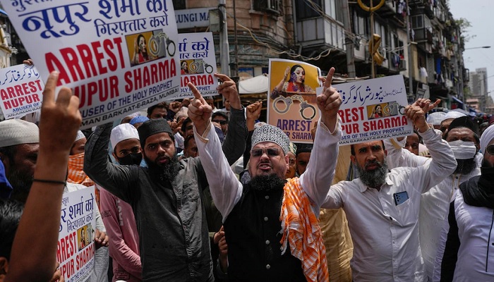 Indian Muslims in Mumbai protest the insulting remarks made by top officials in the governing Hindu nationalist party.—AP