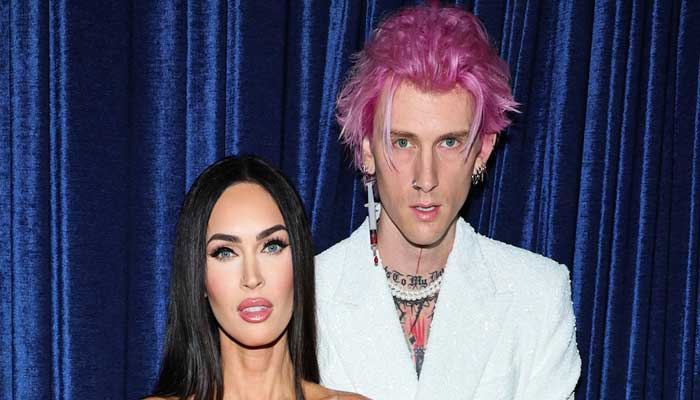 Machine Gun Kelly fashions blood filled syringe earring with fiancée Megan Fox