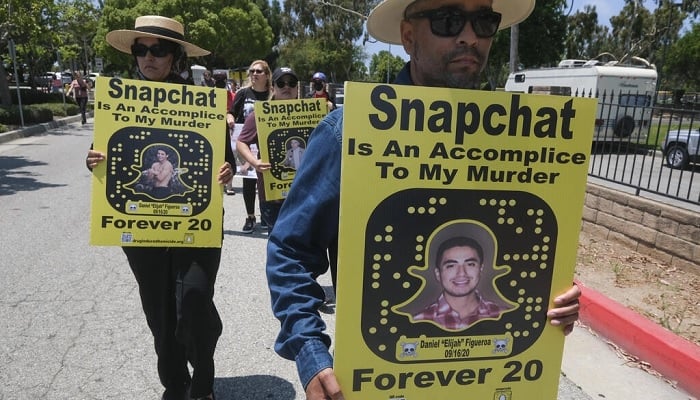 Protesters march in front of Snapchat headquarters in Santa Monica, California on June 13, 2022 demanding social media companies to block the sale of drugs on their platforms —AFP