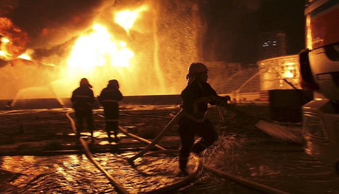 Firefighters try to extinguish a fire at a petrochemical plant in Zhangzhou, Fujian province, April 7, 2015.