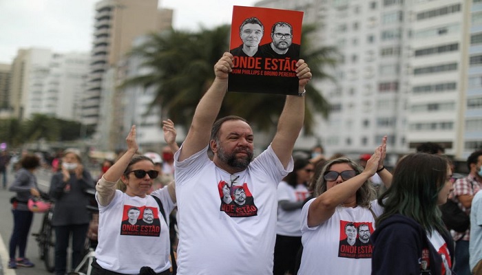 Relatives of British journalist Dom Phillips wife hold placards during a protest following the Amazon disappearance of Phillips and indigenous expert Bruno Araujo Pereira, at Copacabana beach, Rio de Janeiro, Brazil June 12, 2022.—Reuters