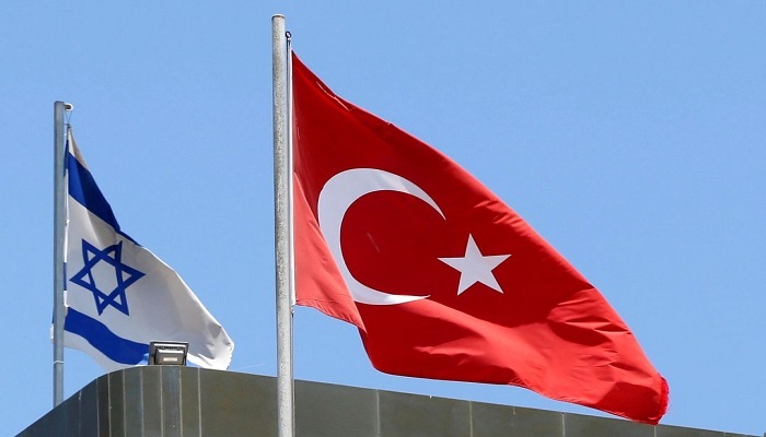 A Turkish flag flutters atop the Turkish embassy as an Israeli flag is seen nearby, in Tel Aviv, Israel June 26, 2016.—Reuters