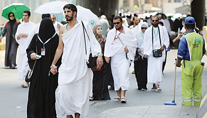 Pilgrims walk on a street in Makkah. PHOTO— AFP/Tribune