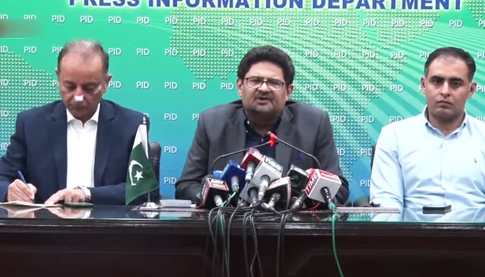 Federal Finance Minister Miftah Ismail (centre) and State Minister for Petroleum Musaddaq Malik (left) addressing a press conference in Islamabad, on June 15, 2022. —  Screengrab via YouTube/PTV