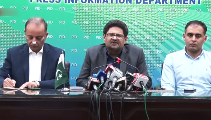 Federal Finance Minister Miftah Ismail (centre) and State Minister for Petroleum Musaddaq Malik (left) addressing a press conference in Islamabad, on June 15, 2022. — Screengrab via YouTube/PTV